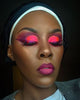 Model wearing Amerindian Paradise eyeshadow palette in a bold red eyeshadow look with high pigment payoff.