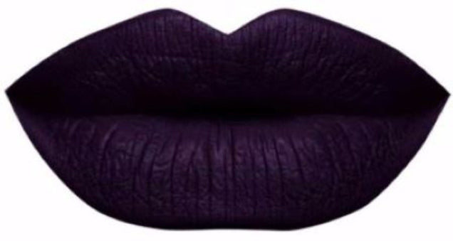 A black plum dark side liquid lipstick swatch showing high-intensity color for bold makeup lovers.
