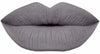 A blue gray stone age liquid lipstick swatch showing high-intensity color for bold makeup lovers.
