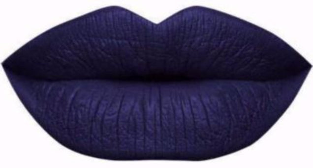 A blue indigo deep blue sea liquid lipstick swatch showing high-intensity color for bold makeup lovers.

