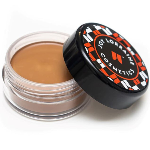 Open jar of cream foundation showing shade for even-tone coverage and radiant glow.