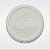 Caribe loose shimmer powder open jar showing radiant pearl highlighter for face and body.
