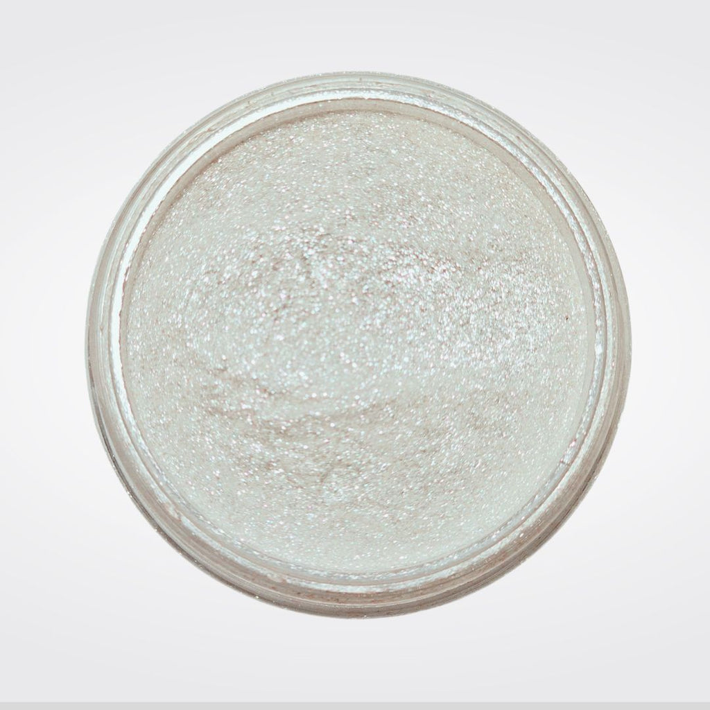 Caribe loose shimmer powder open jar showing radiant pearl highlighter for face and body.