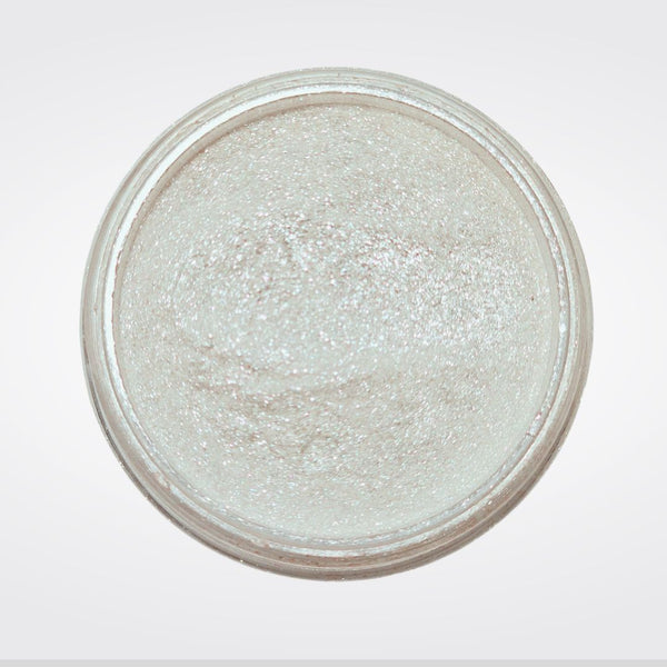 Caribe loose shimmer powder open jar showing radiant pearl highlighter for face and body.
