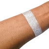 Caribe loose shimmer powder swatch showing radiant pearl highlighter for face and body.