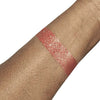 Cherry loose shimmer eyeshadow swatch with silver flecks and vibrant color for eye and body makeup looks.

