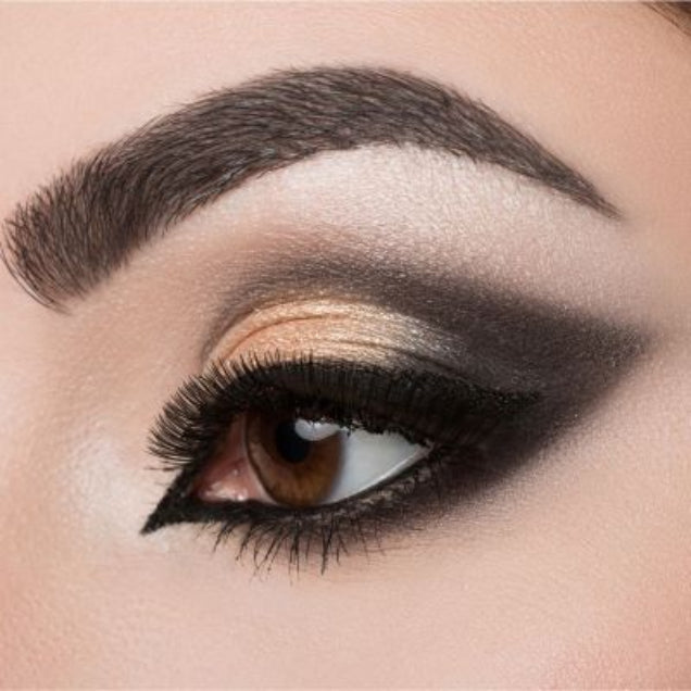 Model wearing chocolate brown brow powder showing enhanced fuller-looking eyebrows.