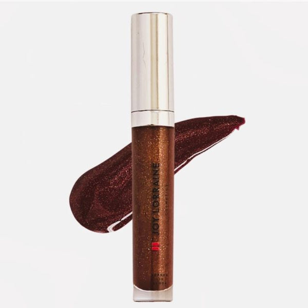 Chocolate vegan lip gloss with high-shine, non-sticky finish shown with swatch designed to complement melanin-rich skin tones.