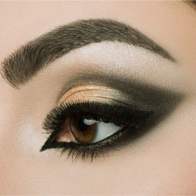 Model wearing coffee brown brow powder showing enhanced fuller-looking eyebrows.