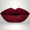 Cool red liquid matte lipstick swatch with high pigment and a smooth transfer-resistant finish designed to complement melanin-rich skin tones.