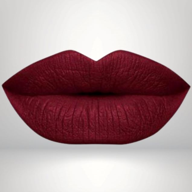 Cool red liquid matte lipstick swatch with high pigment and a smooth transfer-resistant finish designed to complement melanin-rich skin tones.