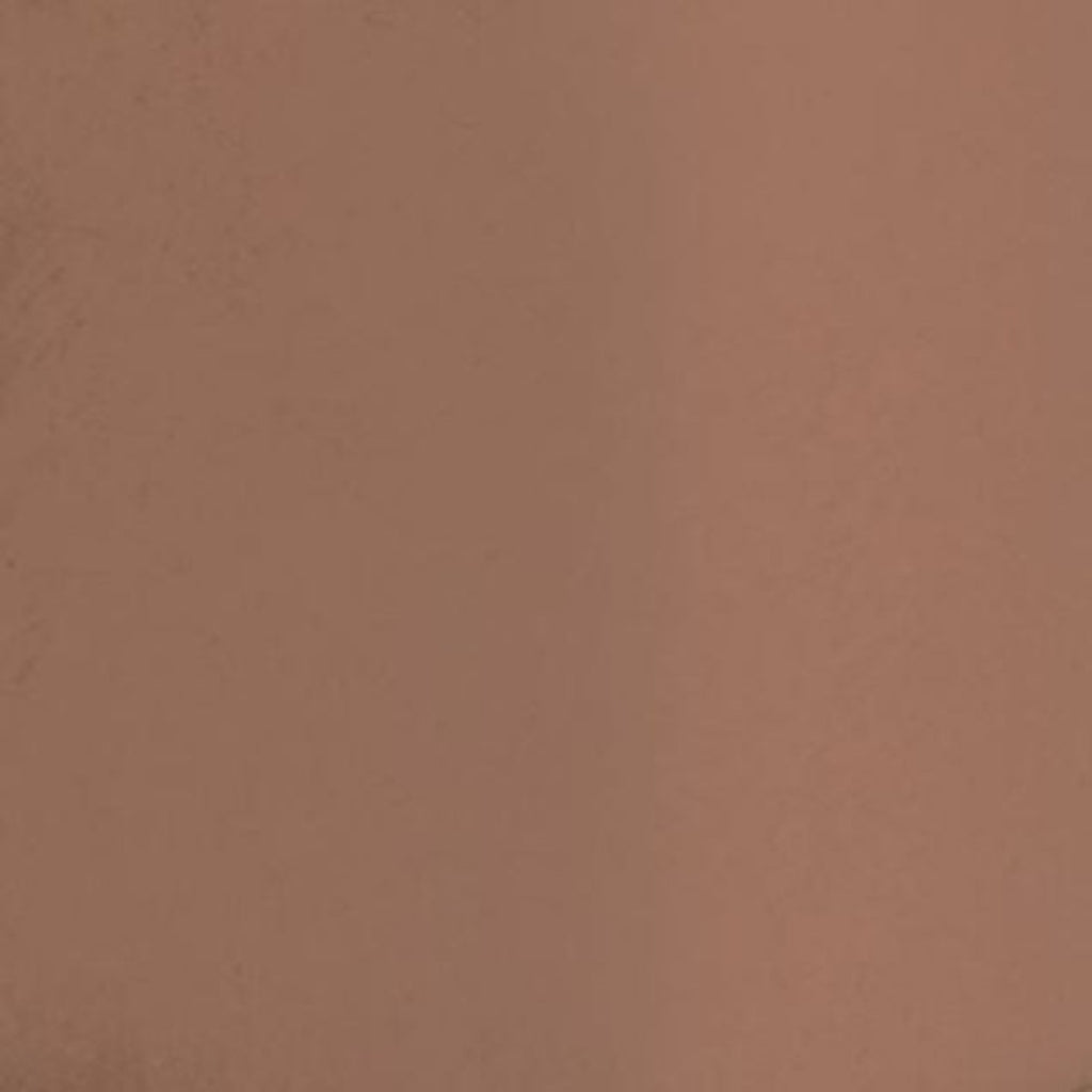 Swatch of full coverage orange base cream foundation makeup designed to complement melanin-rich skin.