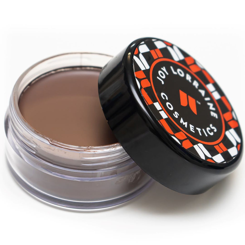 Open jar of lightweight, buildable cream foundation showing rich, deep dark shade for even-tone coverage and radiant glow.