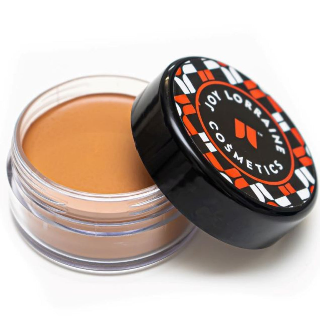 Open jar of lightweight, buildable cream foundation showing shade with a smooth, even-tone finish for a radiant glow.