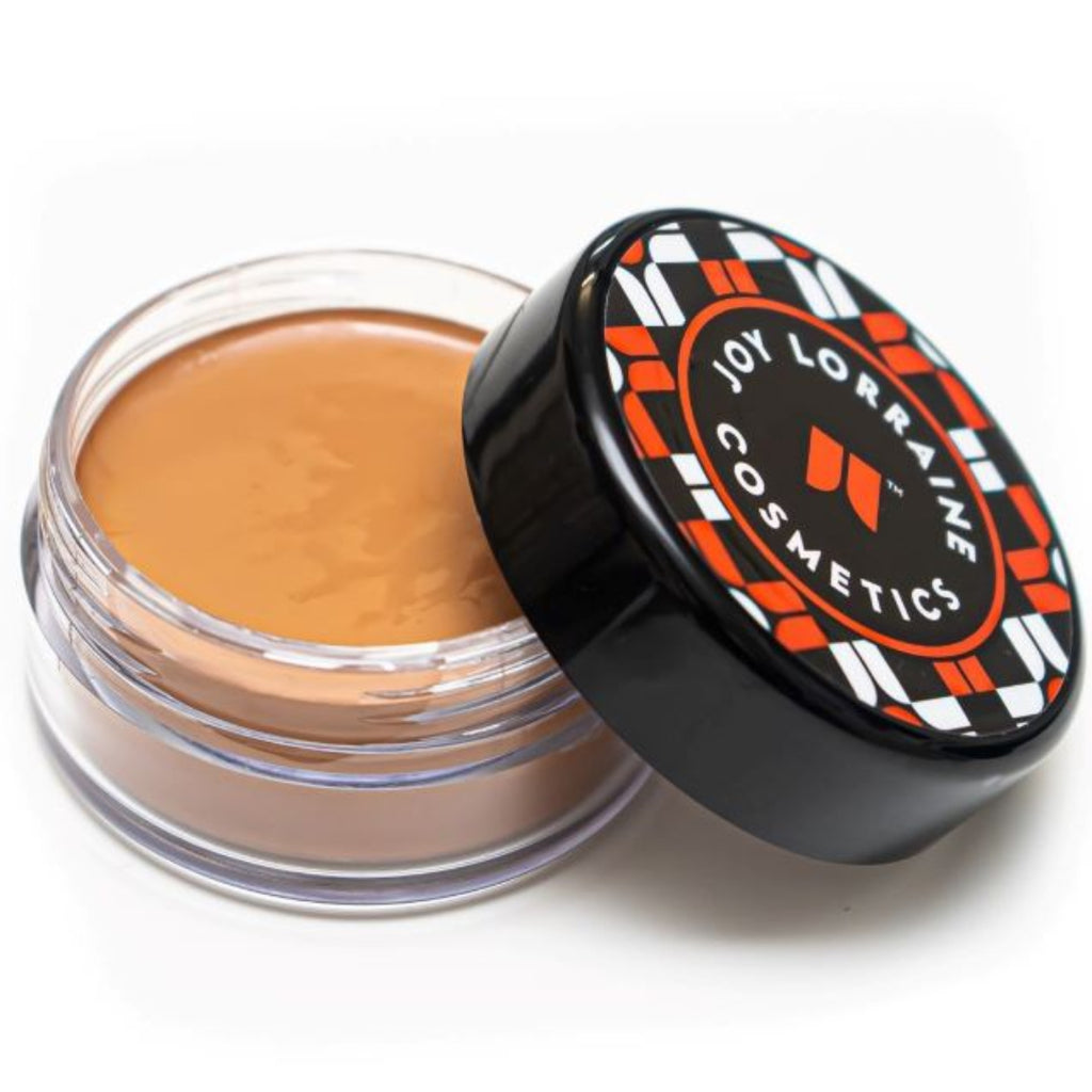 Open jar of lightweight, buildable cream foundation showing shade with a smooth, even-tone finish for a radiant glow.