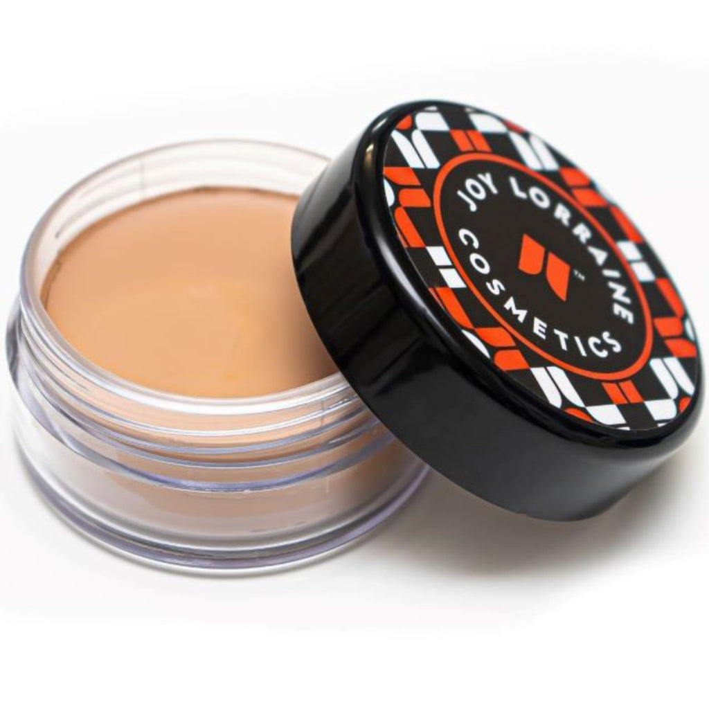 Open jar of lightweight, buildable cream foundation showing shade with a smooth, even-tone finish for a radiant glow.