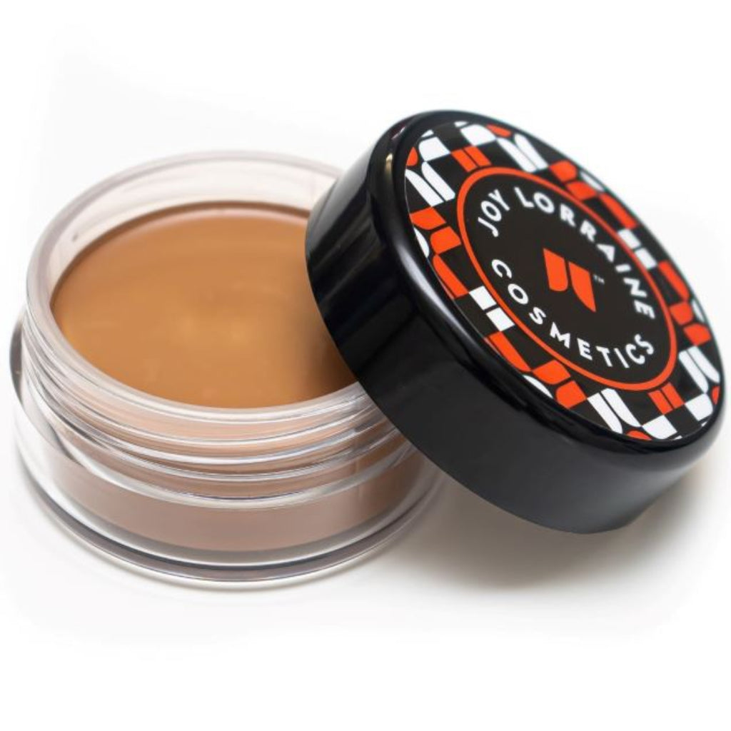 Open jar of lightweight, buildable cream foundation showing shade with a smooth, even-tone finish for a radiant glow.