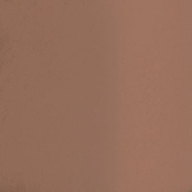 A full-coverage, long-wearing cream foundation with a dewy finish in a warm fudge brown shade for smooth, natural-looking skin.