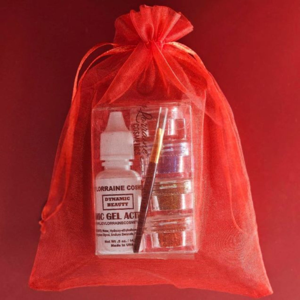 Four cosmetic-grade loose glitters, vegan glitter makeup glue, and mini brush for eyes, face, and body makeup in a red sheer drawstring bag.