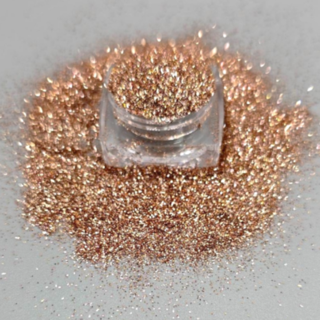 Cosmetic grade loose glitter in open jar with intense sparkles for bold eye looks, face glitter makeup looks, glitter lips and body art.