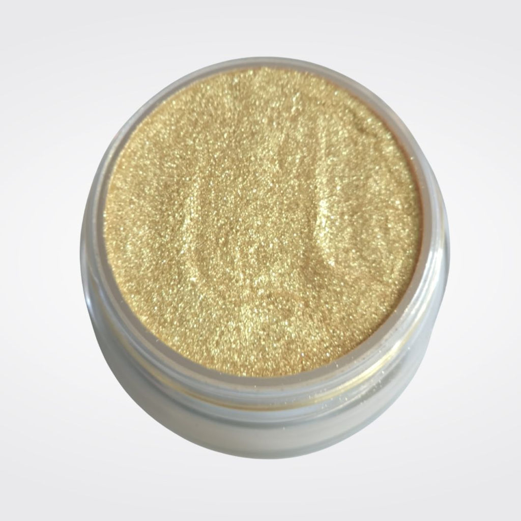 Open jar of Caribe loose gold shimmer highlighter powder in JuliemanGLOW for a radiant face and body glow.
