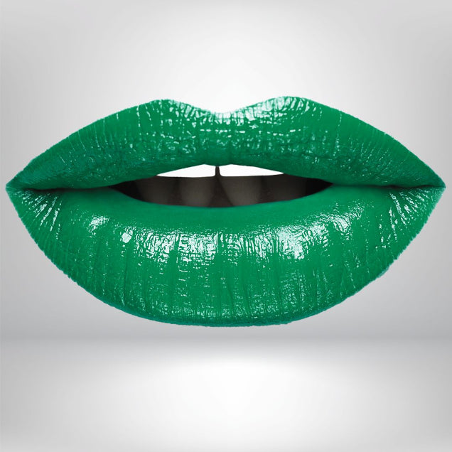 A green metallic wintergreen lipstick swatch showing high-intensity pigments for bold makeup lovers.
