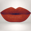 Close-up of lips in burnt orange shade with long-wear, smudge-resistant matte finish.