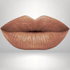 Close-up of lips in warm brown shade with long-wear, smudge-resistant matte finish.