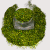 Hunter Green loose glitter - Avocado in open jar with ultrafine cosmetic-grade glitter for eyes, face, lips and body. 