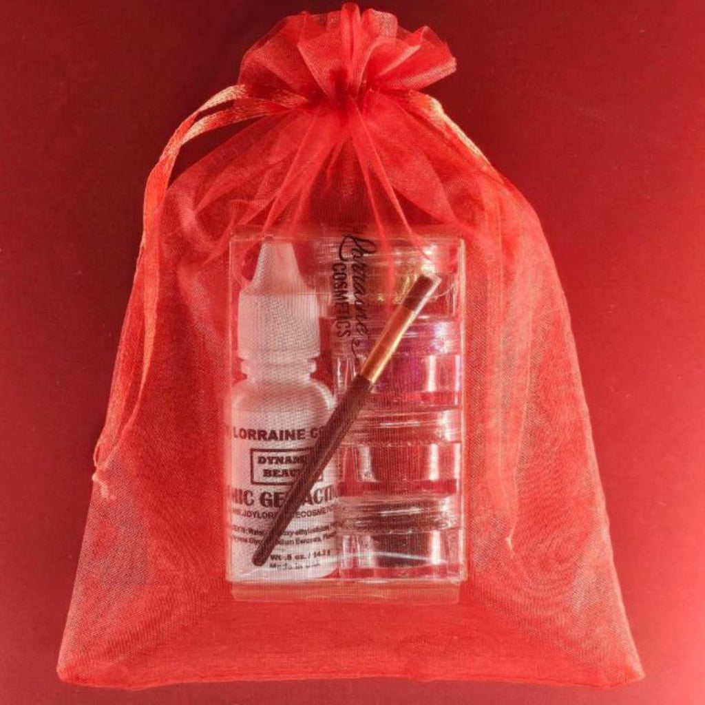 Eye Gazer glitter kit with four loose glitters, vegan glitter glue, and mini brush for eyes, face, and body makeup.