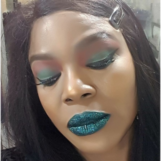 Model wearing Teal loose glitter, Forest Green on lips, with cosmetic-grade glitter also suitable for eyes, face and body. 