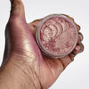 Loose Pink Highlighter - ManGLOWrose  in open jar with hand swatch showing iridescent pink highlighter makeup for face and body. 