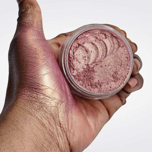 Loose Pink Highlighter - ManGLOWrose  in open jar with hand swatch showing iridescent pink highlighter makeup for face and body. 