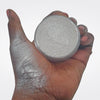 Loose White Highlighter - ChaGLOWnas  in open jar with hand swatch showing bright white highlighter makeup for face and body. 