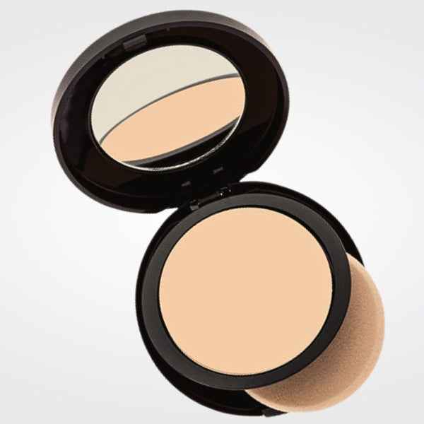Open compact with medium olive powder foundation with sponge applicator in Honey shade.
