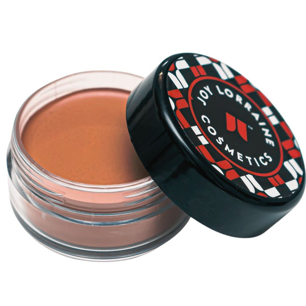 Moonlight Chocolate Caribe Cream Foundation in open jar with creamy formula for smooth even-tone coverage.
