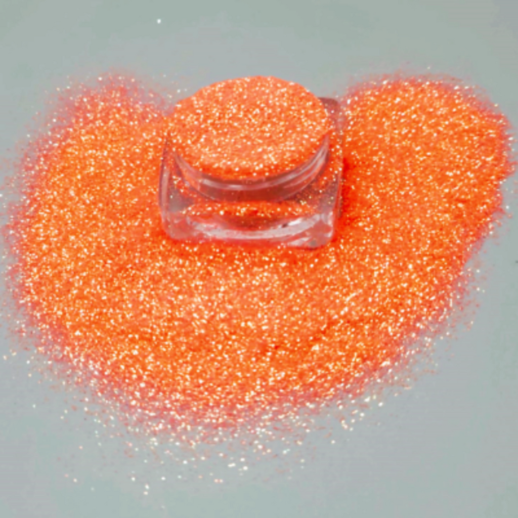 Cosmetic grade loose glitter in open jar with intense sparkles for bold eye looks, face glitter makeup looks, glitter lips and body art.