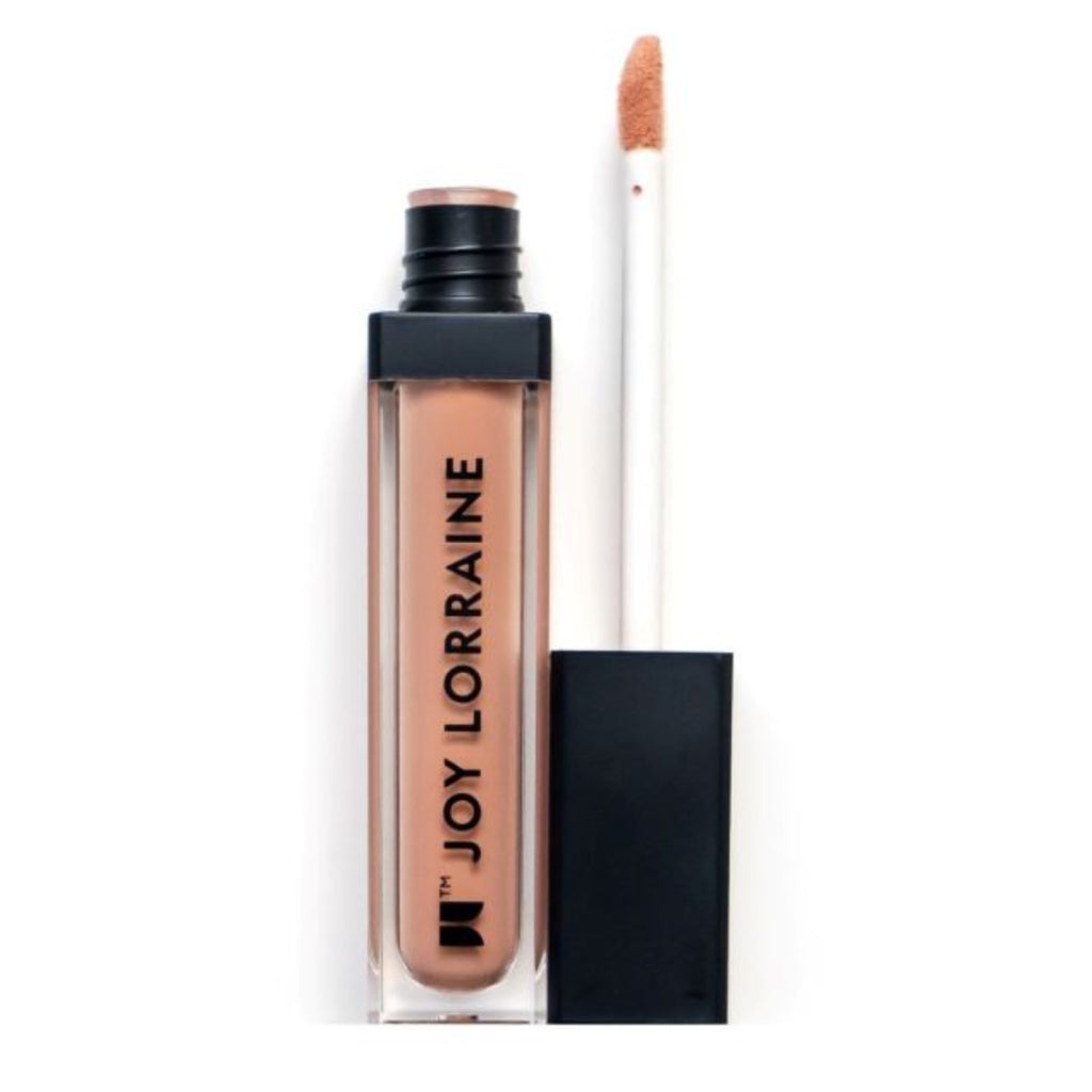 Peach liquid matte lipstick with high pigment and a smooth, transfer-resistant finish designed to complement melanin-rich skin tones. 