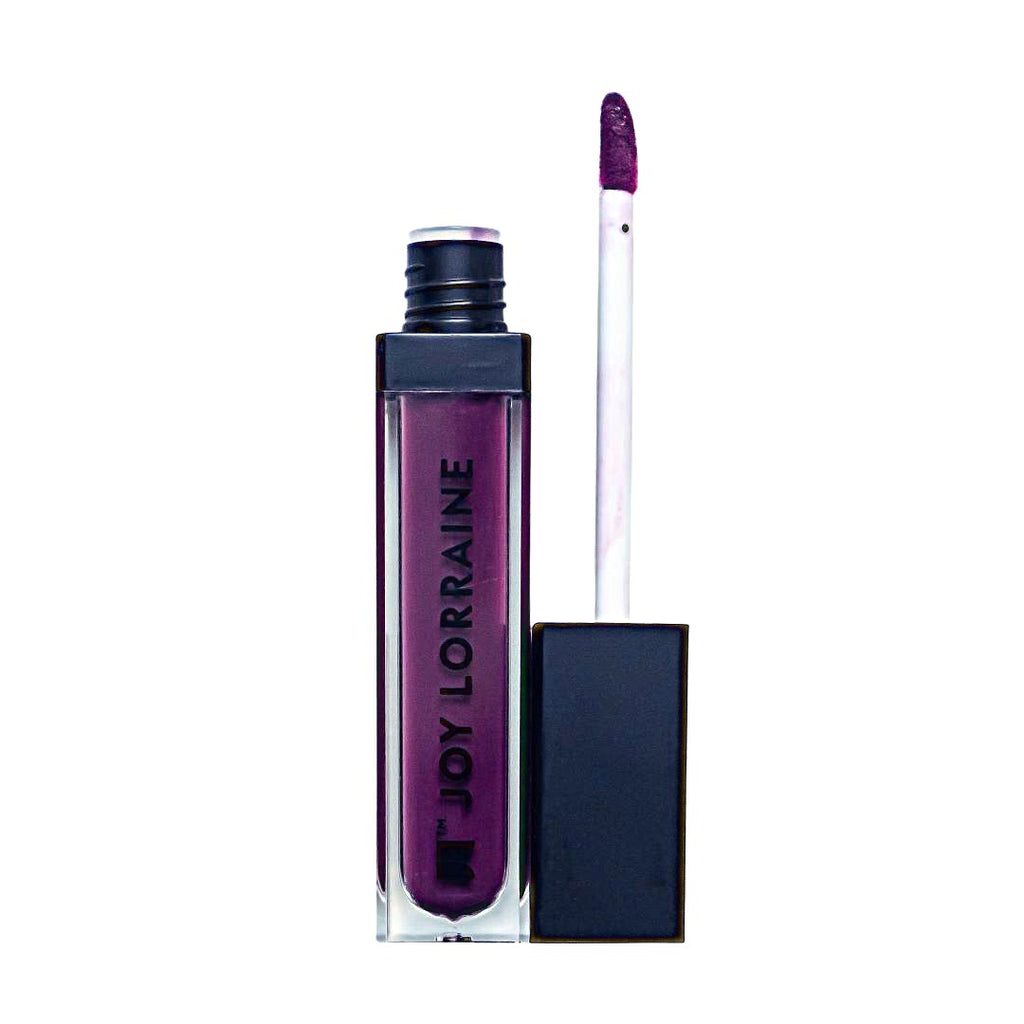 Purple liquid matte lipstick with high pigment and a smooth, transfer-resistant finish designed to wear beautifully on melanin-rich skin.
