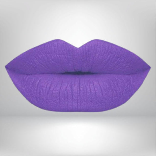 A midtone purple matte island punch lipstick swatch showing high-intensity color for bold makeup lovers. 
