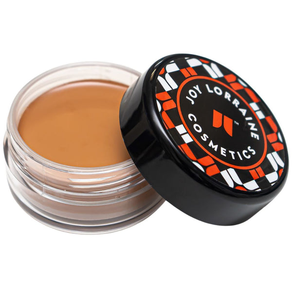 Roasted Chestnut Caribe Cream Foundation in open jar with creamy formula for smooth even-tone coverage.
