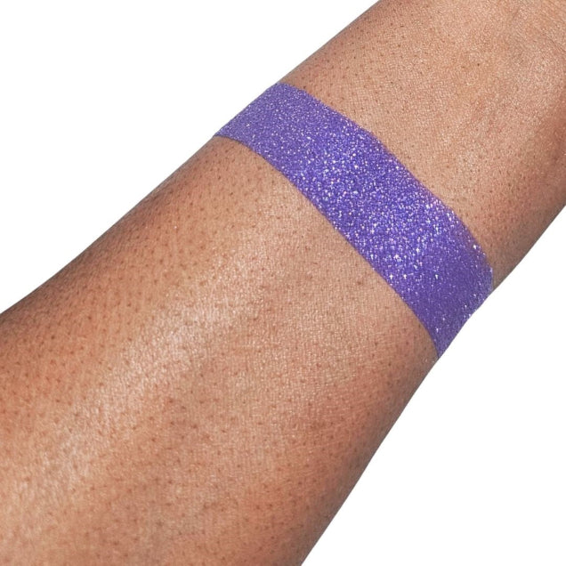 Violet loose shimmer eyeshadow swatch with silver flecks and vibrant color for eye and body makeup looks.
