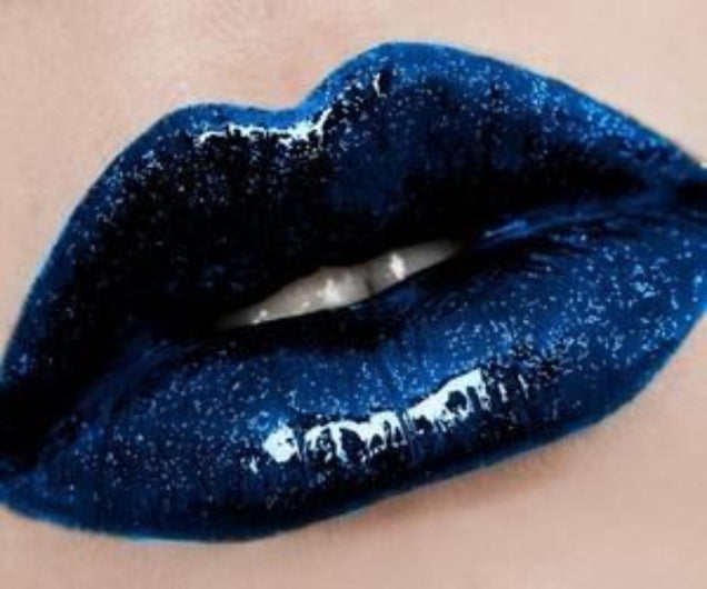 Blue Metallic Pacific Lip Gloss swatch showing royal blue shade over lipstick for bold makeup lovers.
