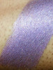 Swatch of Plum Shimmer Eyeshadow; a loose eyeshadow with microfine sparkling particles.